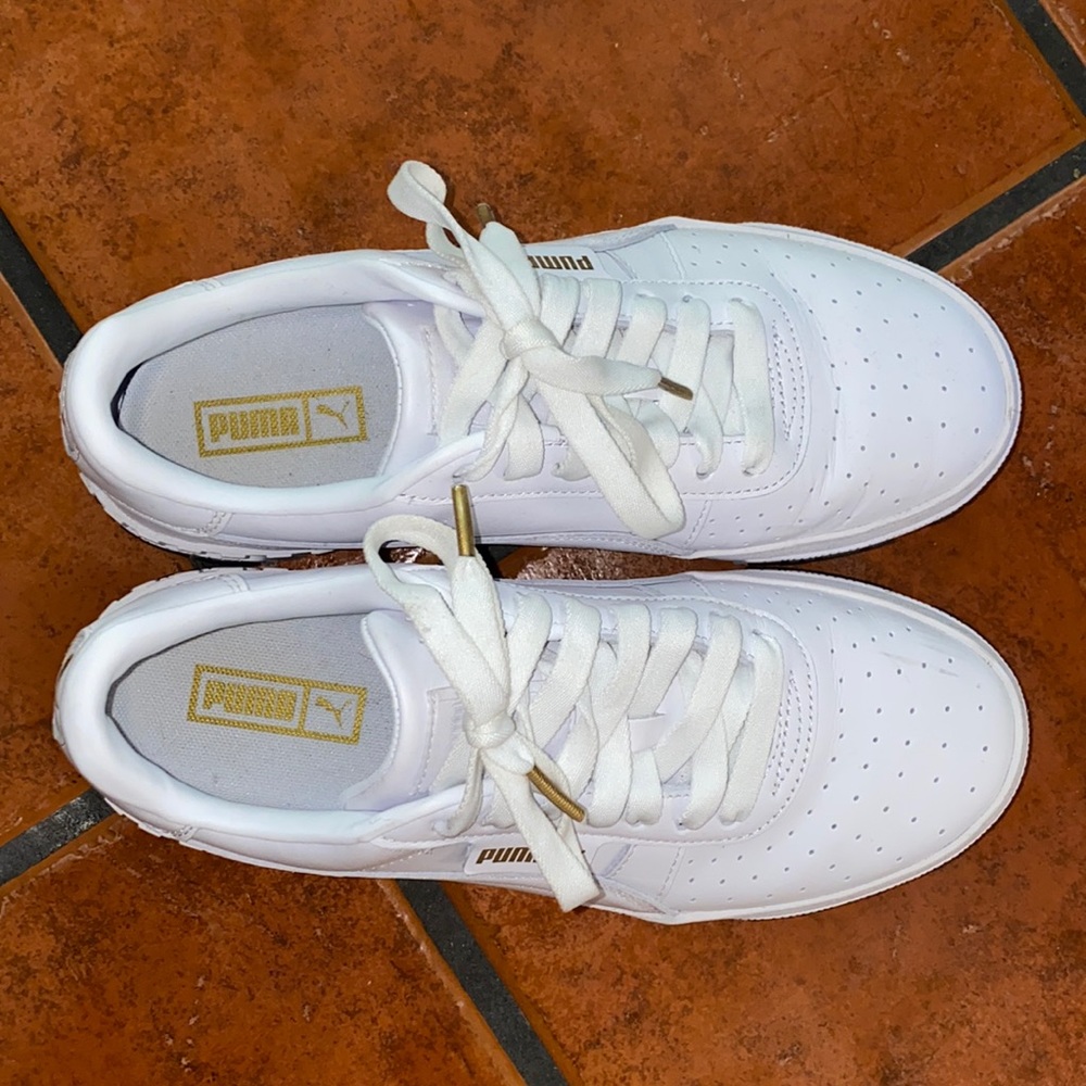 Puma sneakers. Size 9.5. White, bits of black and gold. Like New Condition!